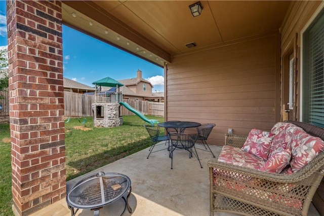 5825 Loveland Dr, Denton, TX 76208 - view of patio / terrace with a playground and outdoor dining area