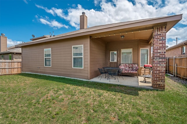5825 Loveland Dr, Denton, TX 76208 - rear view of property with a patio and a chimney