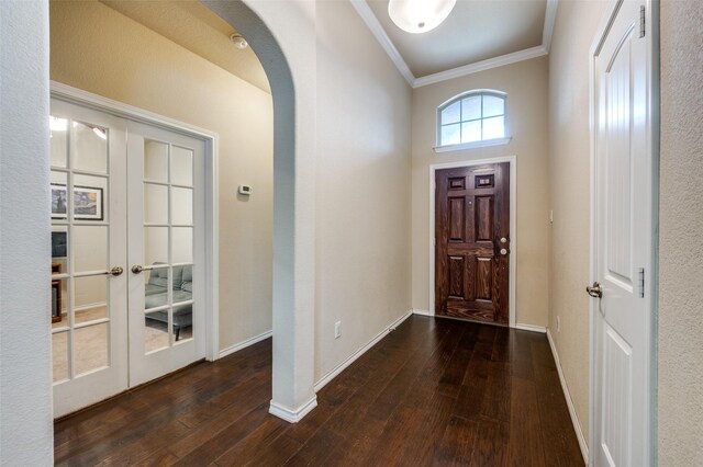 5825 Loveland Dr, Denton, TX 76208 - foyer featuring crown molding, arched walkways, hardwood / wood-style flooring, french doors, and baseboards