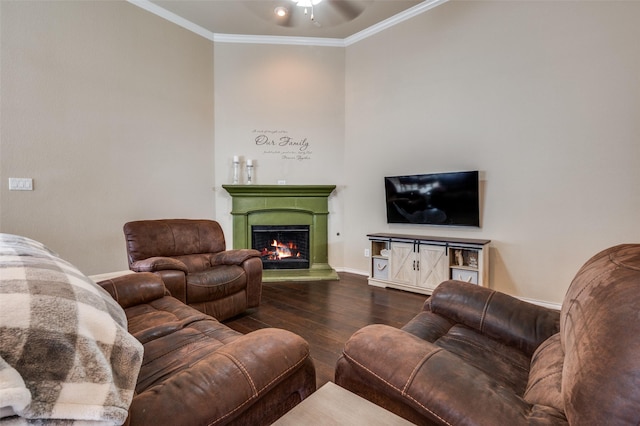 5825 Loveland Dr, Denton, TX 76208 - living area with wood-type flooring, ornamental molding, a lit fireplace, baseboards, and a ceiling fan