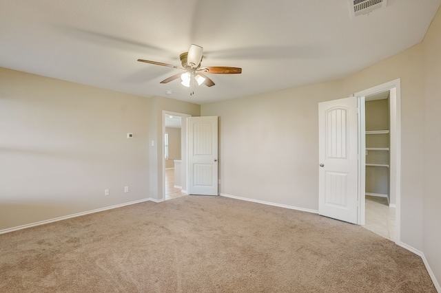 2113 Rubin Rd, Fate, TX 75189 - unfurnished bedroom with carpet flooring, baseboards, ceiling fan, and a spacious closet