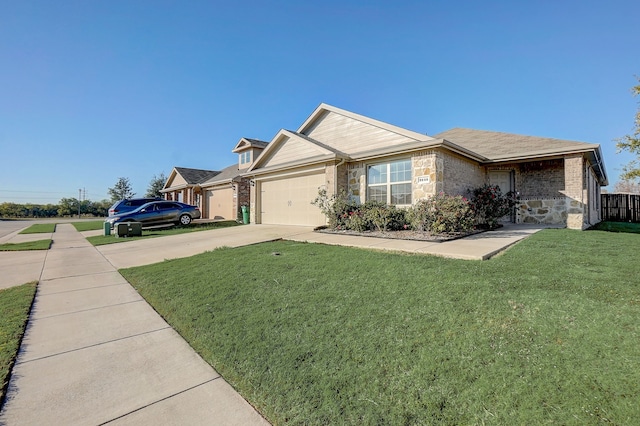 2113 Rubin Rd, Fate, TX 75189 - ranch-style house featuring an attached garage, driveway, and stone siding
