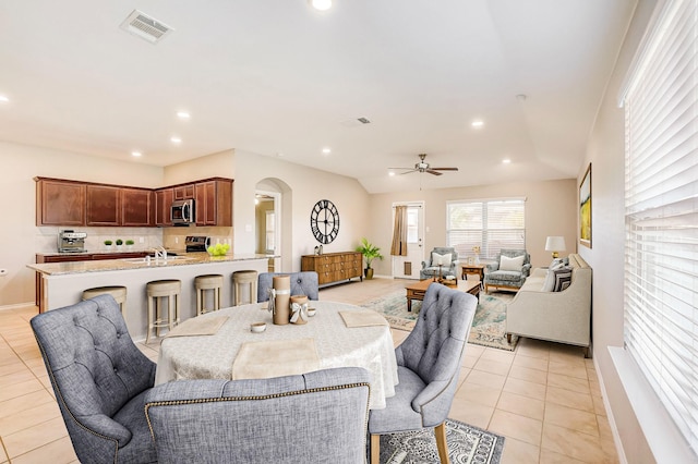 2113 Rubin Rd, Fate, TX 75189 - dining space featuring arched walkways, ceiling fan, light tile patterned floors, baseboards, and recessed lighting