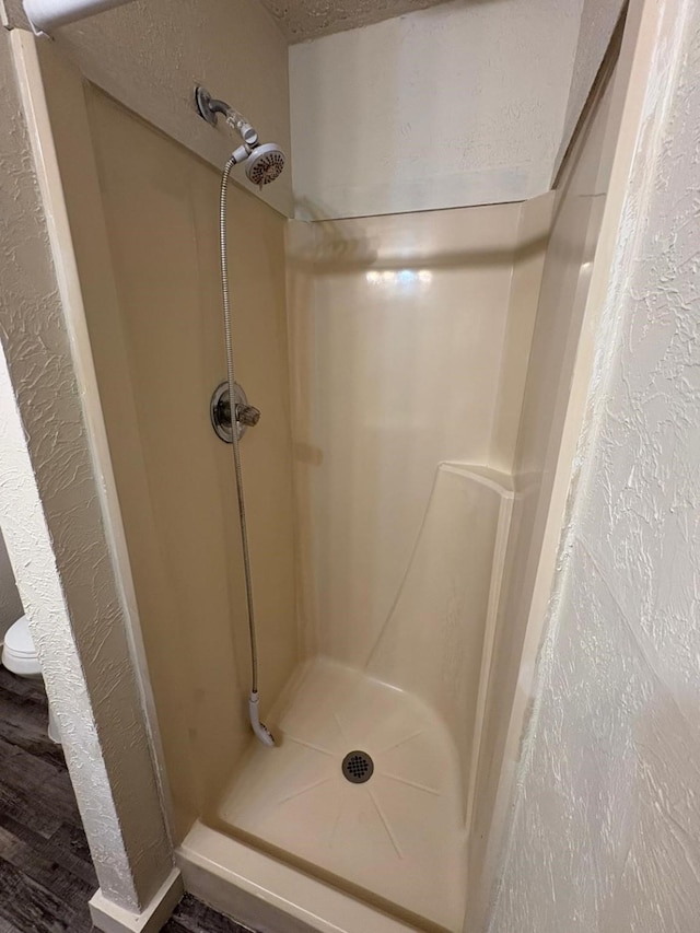 6827 Ensign Rd, Ennis, TX 75119 - bathroom with a stall shower and a textured wall