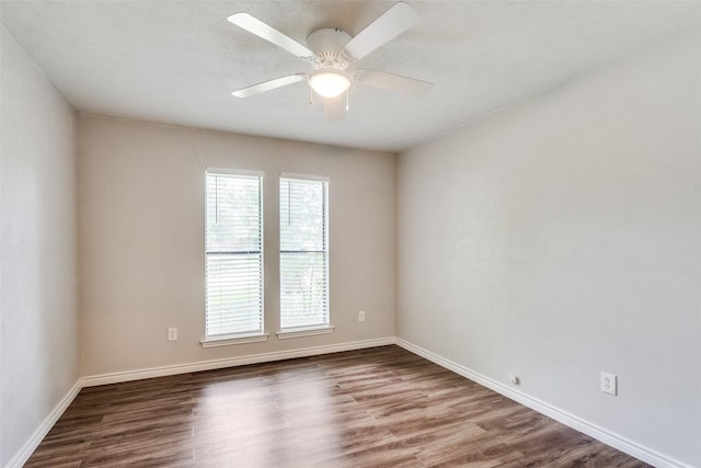 2309 Merrimac Dr, Plano, TX 75075 - unfurnished room with wood finished floors, baseboards, and a ceiling fan