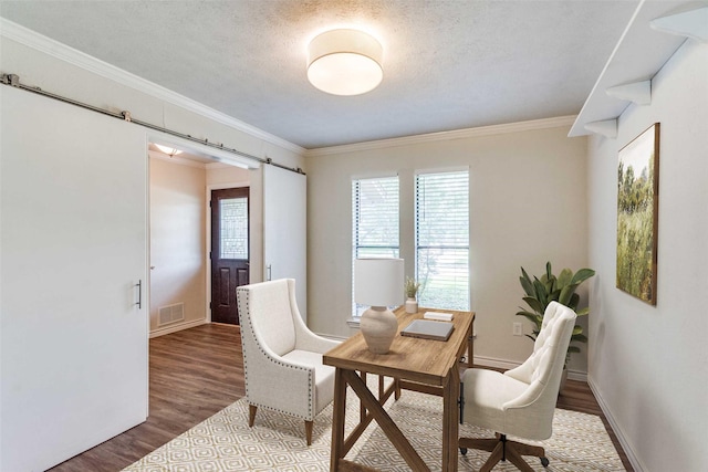 2309 Merrimac Dr, Plano, TX 75075 - office area with a barn door, plenty of natural light, wood finished floors, baseboards, and ornamental molding