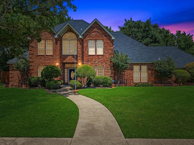 1027 Beaver Creek Dr, Duncanville, TX 75137 - traditional-style house featuring roof with shingles and a lawn