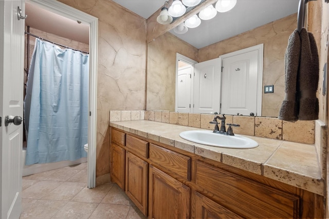 1205 Platte Dr, Mansfield, TX 76063 - bathroom featuring vanity, toilet, tile patterned floors, and shower / tub combo