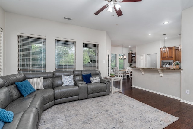 3400 Eisenhower Ave, Melissa, TX 75454 - living area with a ceiling fan, dark wood-style flooring, recessed lighting, baseboards, and a chandelier