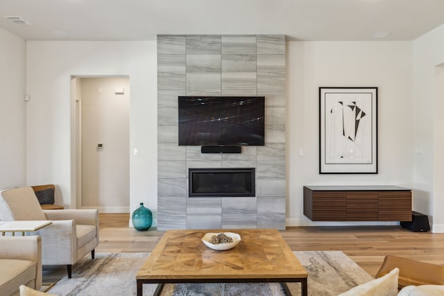 32 Katie Ln, Trophy Club, TX 76262 - living room with light wood-style floors, baseboards, and a tile fireplace