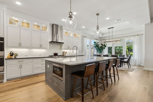 32 Katie Ln, Trophy Club, TX 76262 - kitchen featuring stainless steel appliances, wall chimney range hood, healthy amount of natural light, backsplash, and recessed lighting