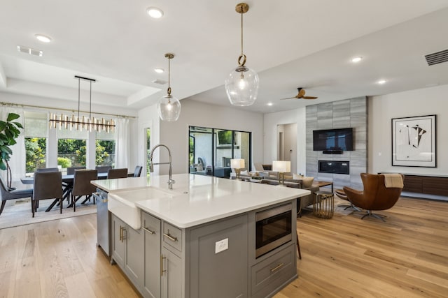 32 Katie Ln, Trophy Club, TX 76262 - kitchen featuring appliances with stainless steel finishes, gray cabinets, a sink, healthy amount of natural light, and recessed lighting