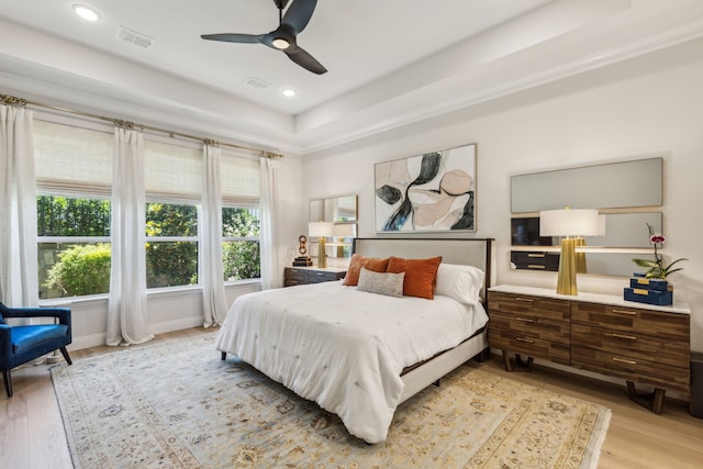 32 Katie Ln, Trophy Club, TX 76262 - bedroom with wood finished floors, a raised ceiling, recessed lighting, a ceiling fan, and baseboards