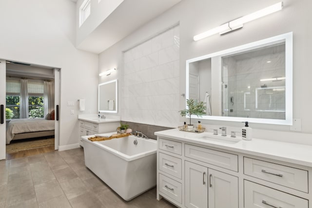 32 Katie Ln, Trophy Club, TX 76262 - bathroom with a shower stall, two vanities, a soaking tub, and plenty of natural light