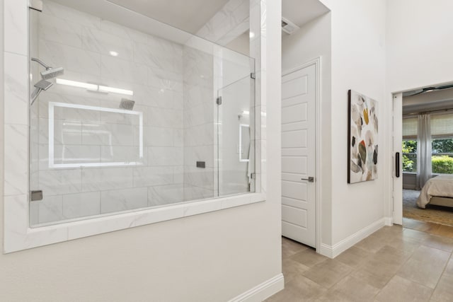 32 Katie Ln, Trophy Club, TX 76262 - ensuite bathroom with baseboards and a tile shower