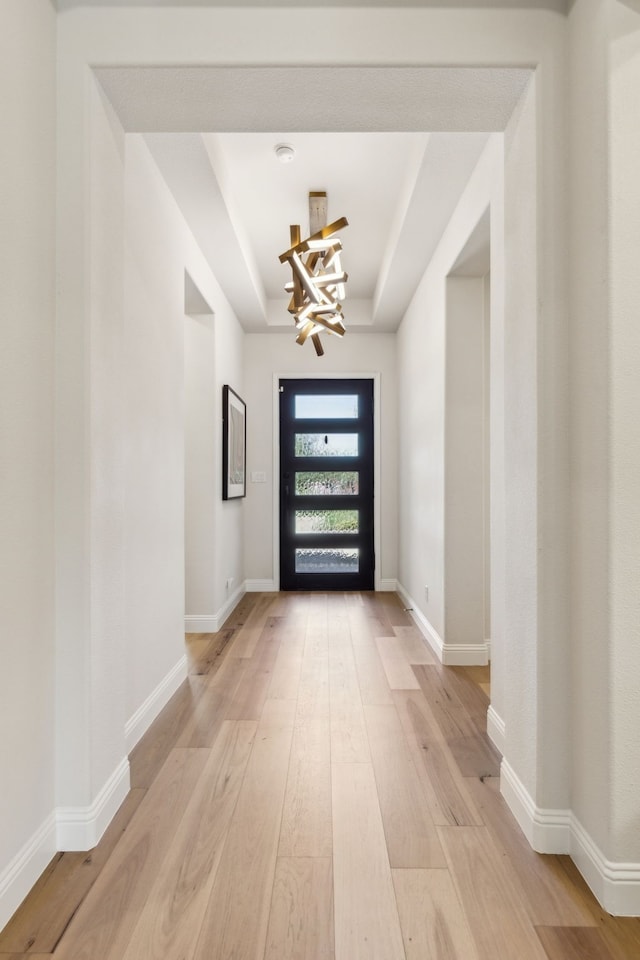 32 Katie Ln, Trophy Club, TX 76262 - entryway featuring a raised ceiling, a chandelier, light wood-type flooring, and baseboards