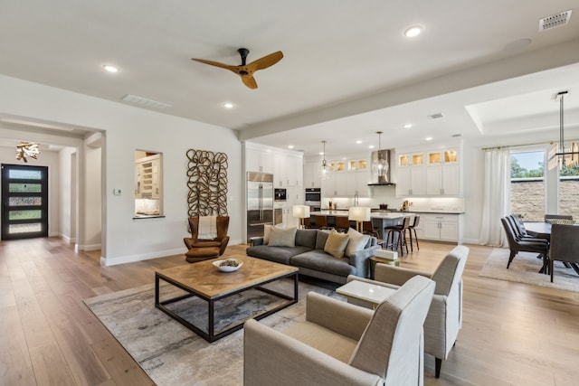 32 Katie Ln, Trophy Club, TX 76262 - living room with a chandelier, light wood-style flooring, baseboards, ceiling fan, and recessed lighting