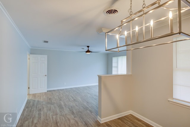 732 Camilla Dr, Shreveport, LA 71104 - empty room with wood finished floors, a ceiling fan, ornamental molding, and baseboards