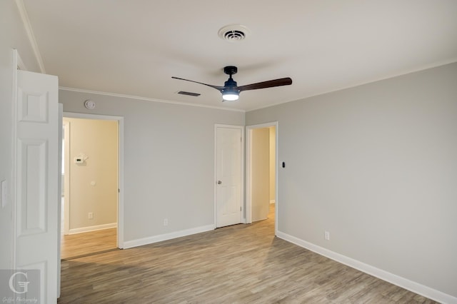 732 Camilla Dr, Shreveport, LA 71104 - unfurnished bedroom with light wood finished floors, ornamental molding, baseboards, and ceiling fan