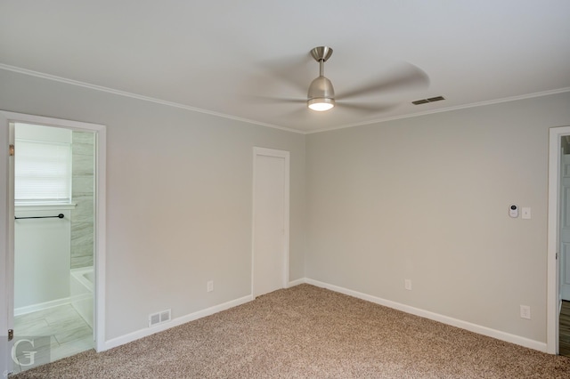 732 Camilla Dr, Shreveport, LA 71104 - unfurnished bedroom featuring carpet floors, ornamental molding, baseboards, ensuite bath, and ceiling fan