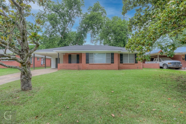 732 Camilla Dr, Shreveport, LA 71104 - ranch-style house featuring concrete driveway, a front lawn, a carport, and brick siding