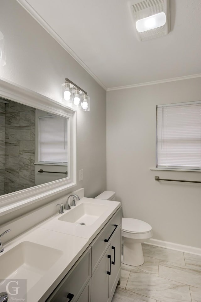 732 Camilla Dr, Shreveport, LA 71104 - bathroom featuring double vanity, toilet, crown molding, and baseboards