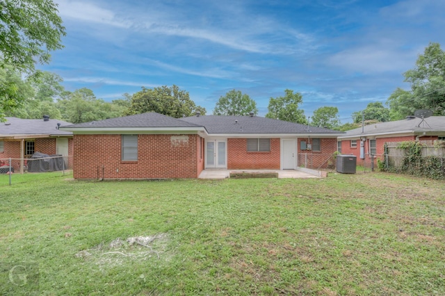 732 Camilla Dr, Shreveport, LA 71104 - rear view of house with central AC, a patio area, and brick siding