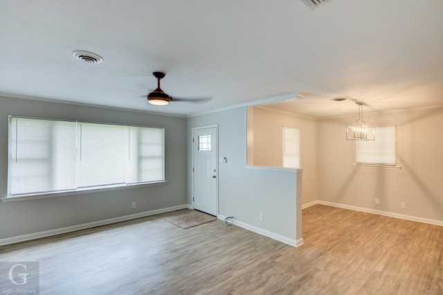 732 Camilla Dr, Shreveport, LA 71104 - entrance foyer featuring crown molding, wood finished floors, baseboards, a chandelier, and ceiling fan