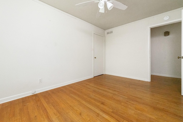 6908 Park Place Dr, Richland Hills, TX 76118 - empty room with ceiling fan, light wood-style flooring, a smoke detector, and ornamental molding