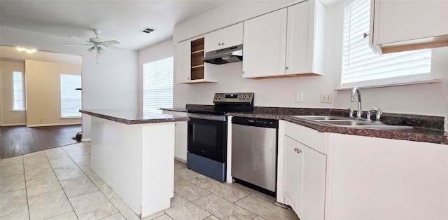 510 E Stone Cir, Wylie, TX 75098 - kitchen featuring stainless steel appliances, a sink, under cabinet range hood, white cabinets, and healthy amount of natural light
