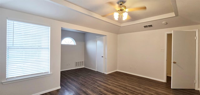 510 E Stone Cir, Wylie, TX 75098 - empty room with a raised ceiling, dark wood-style flooring, baseboards, a ceiling fan, and a smoke detector