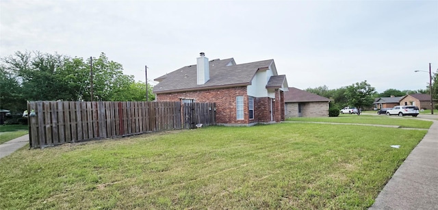 510 E Stone Cir, Wylie, TX 75098 - view of property exterior featuring brick siding and a chimney