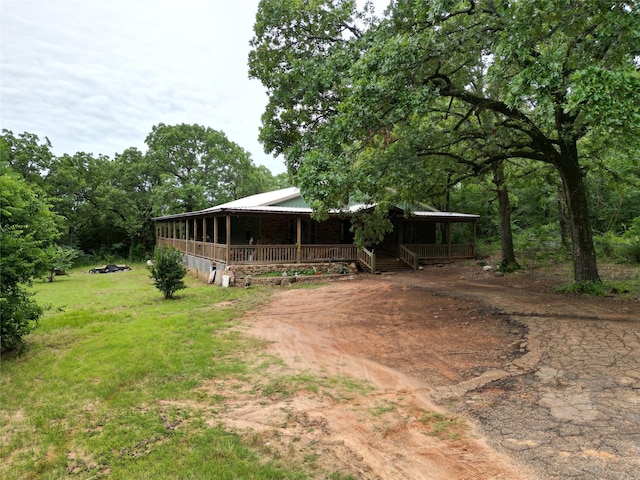 18637 Fm 17, Canton, TX 75103 - view of front of home with a porch, metal roof, and driveway