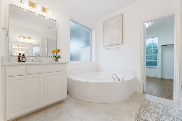 3601 Aqua Springs Dr, Plano, TX 75025 - full bathroom featuring vanity, a bath, and tile patterned flooring