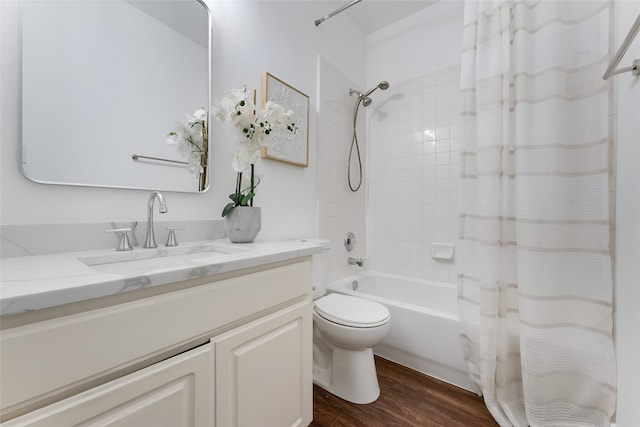 3601 Aqua Springs Dr, Plano, TX 75025 - bathroom with wood finished floors, shower / bath combo with shower curtain, vanity, and toilet