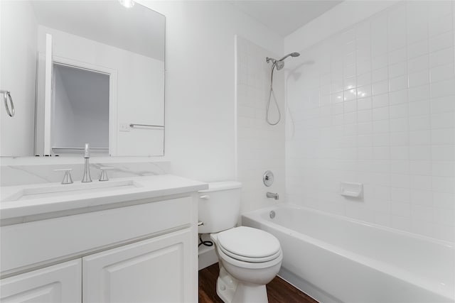 3601 Aqua Springs Dr, Plano, TX 75025 - bathroom with toilet, vanity, washtub / shower combination, and wood finished floors