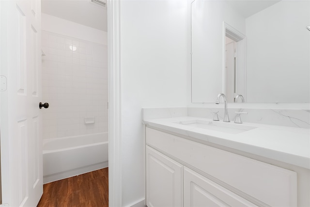 3601 Aqua Springs Dr, Plano, TX 75025 - bathroom featuring vanity, wood finished floors, and  shower combination