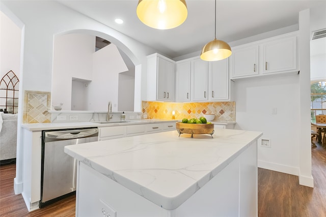 3601 Aqua Springs Dr, Plano, TX 75025 - kitchen featuring stainless steel dishwasher, a sink, dark wood-type flooring, white cabinets, and arched walkways