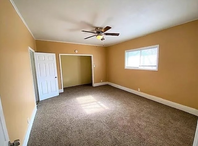 909 S Montgomery St, Sherman, TX 75090 - unfurnished bedroom with carpet flooring, baseboards, and a ceiling fan