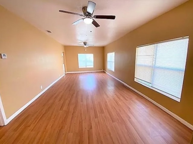 909 S Montgomery St, Sherman, TX 75090 - unfurnished room featuring light wood-style floors, baseboards, and ceiling fan