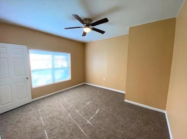 909 S Montgomery St, Sherman, TX 75090 - empty room featuring ceiling fan, carpet floors, and baseboards