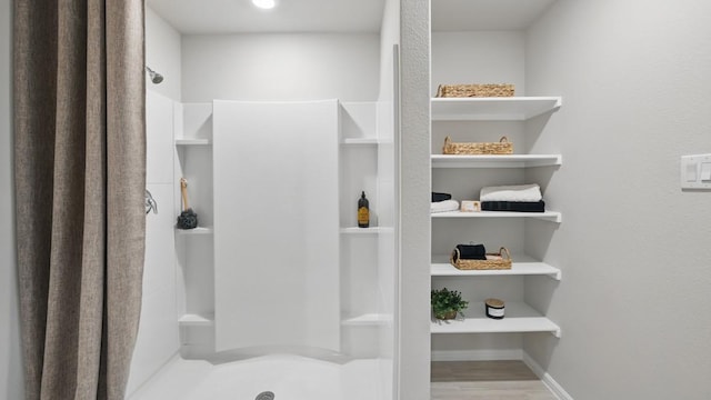 8417 Stout Dr, Fort Worth, TX 76131 - full bathroom featuring a stall shower and wood finished floors