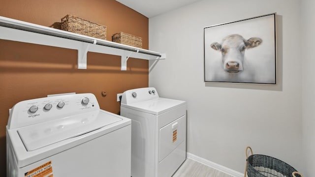8417 Stout Dr, Fort Worth, TX 76131 - laundry room with washing machine and dryer and baseboards