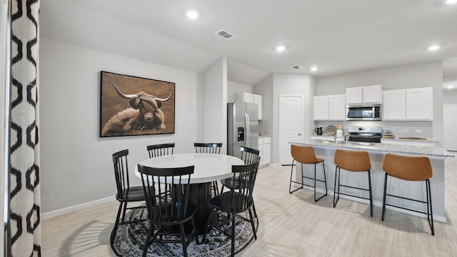 8417 Stout Dr, Fort Worth, TX 76131 - dining room with baseboards, recessed lighting, and vaulted ceiling