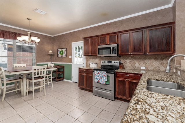 910 Glenbrook Dr, Grand Prairie, TX 75052 - kitchen with appliances with stainless steel finishes, a sink, light tile patterned floors, a chandelier, and tasteful backsplash