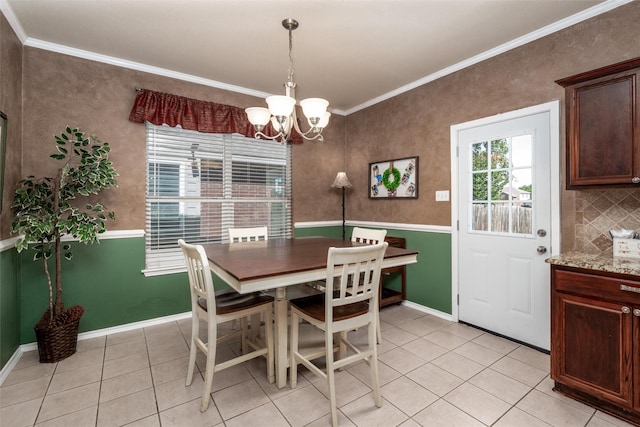 910 Glenbrook Dr, Grand Prairie, TX 75052 - dining room with light tile patterned flooring, ornamental molding, a chandelier, and baseboards