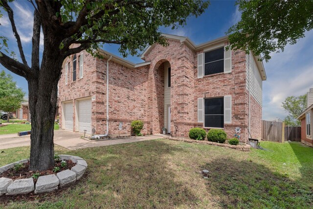 910 Glenbrook Dr, Grand Prairie, TX 75052 - traditional home with an attached garage, brick siding, and concrete driveway