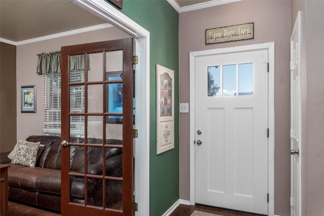 910 Glenbrook Dr, Grand Prairie, TX 75052 - foyer with ornamental molding, wood finished floors, and baseboards