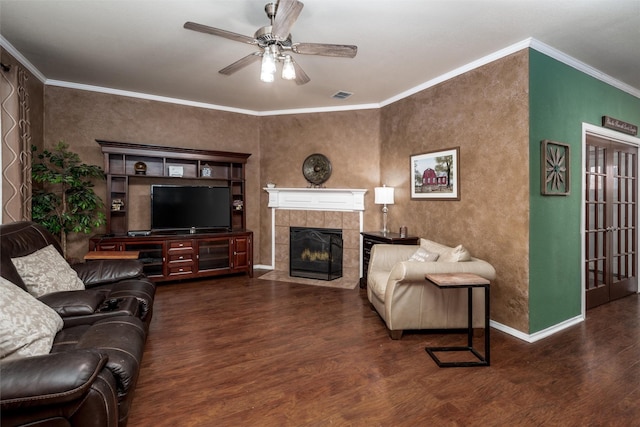 910 Glenbrook Dr, Grand Prairie, TX 75052 - living room featuring wood finished floors, ceiling fan, baseboards, a fireplace, and ornamental molding