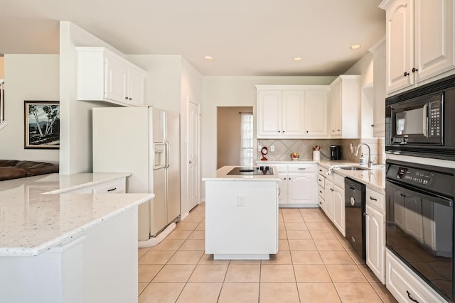 8633 Shadow Trace Dr, Fort Worth, TX 76244 - kitchen with black appliances, a sink, tasteful backsplash, white cabinets, and light tile patterned flooring